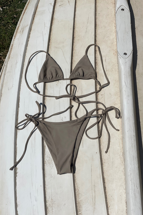 High-quality product shot of the Celestina teal bikini bottom with side ties on a polished white background.