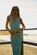 Menita maxi dress midnight green styled on model, V-silhouette — Punta Loca