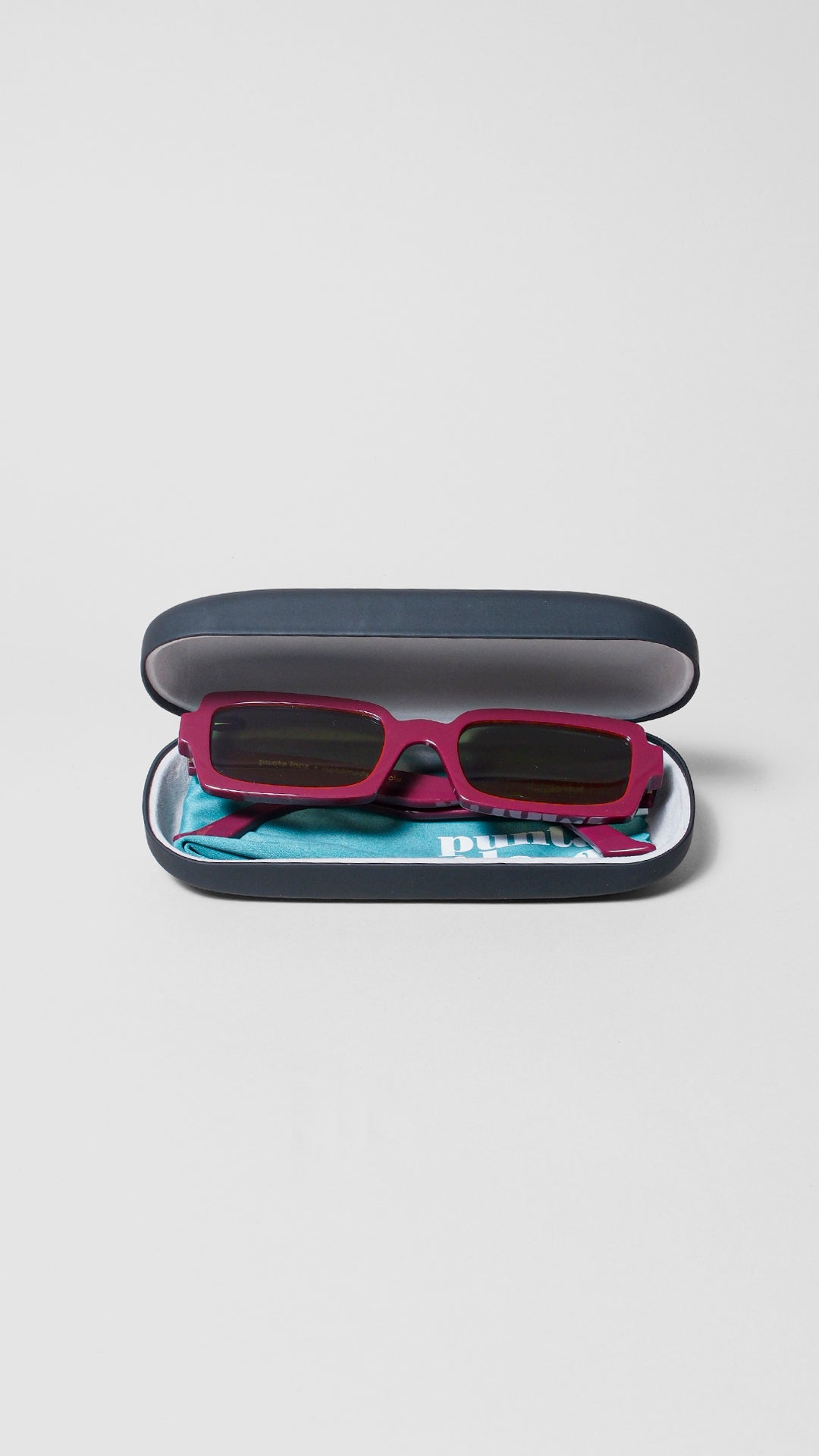 Singularidad burgundy sunglasses in protective case — handmade Italian eyewear by Punta Loca