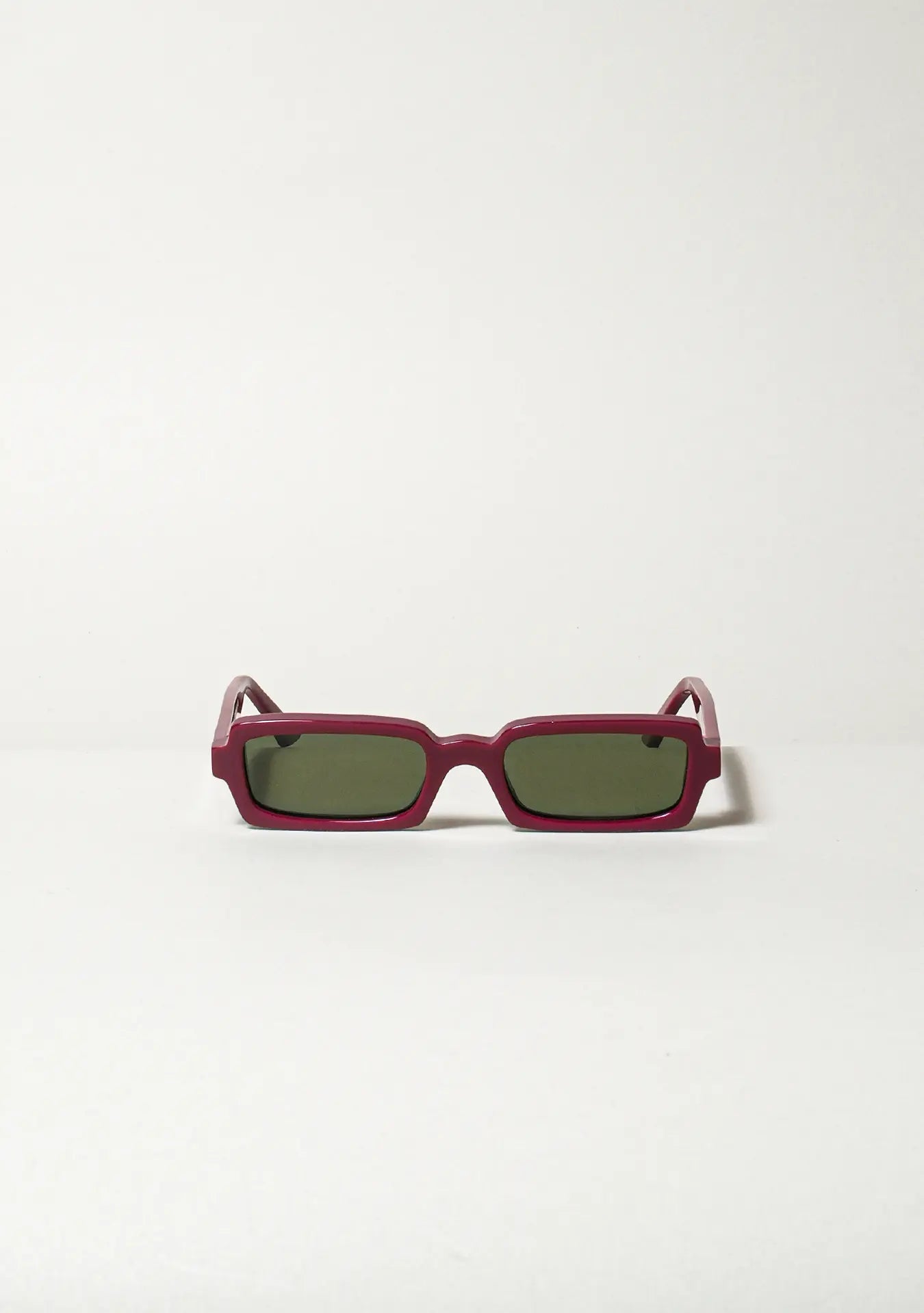 Singularidad burgundy sunglasses, sculptural Italian eyewear handmade in recycled acetate — Punta Loca